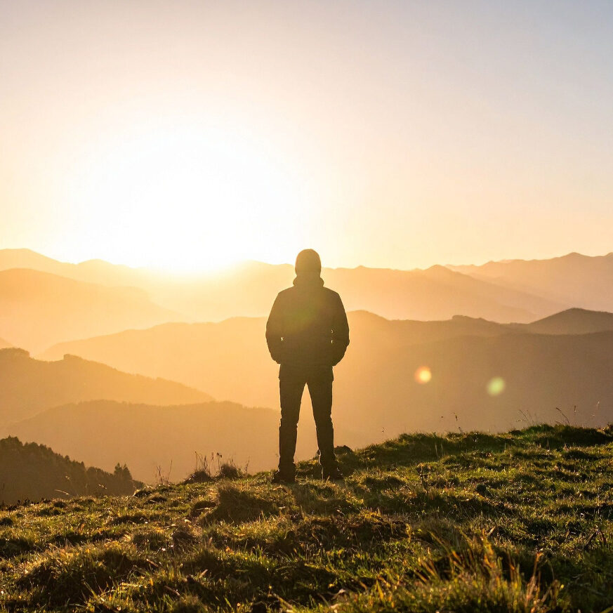Man looking out mountain top